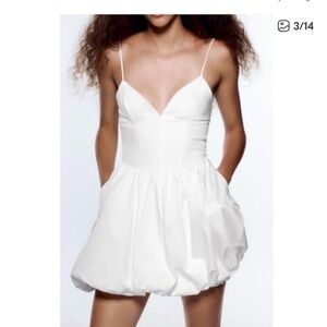 White romper that is the appearance of a dress! Never been worn!